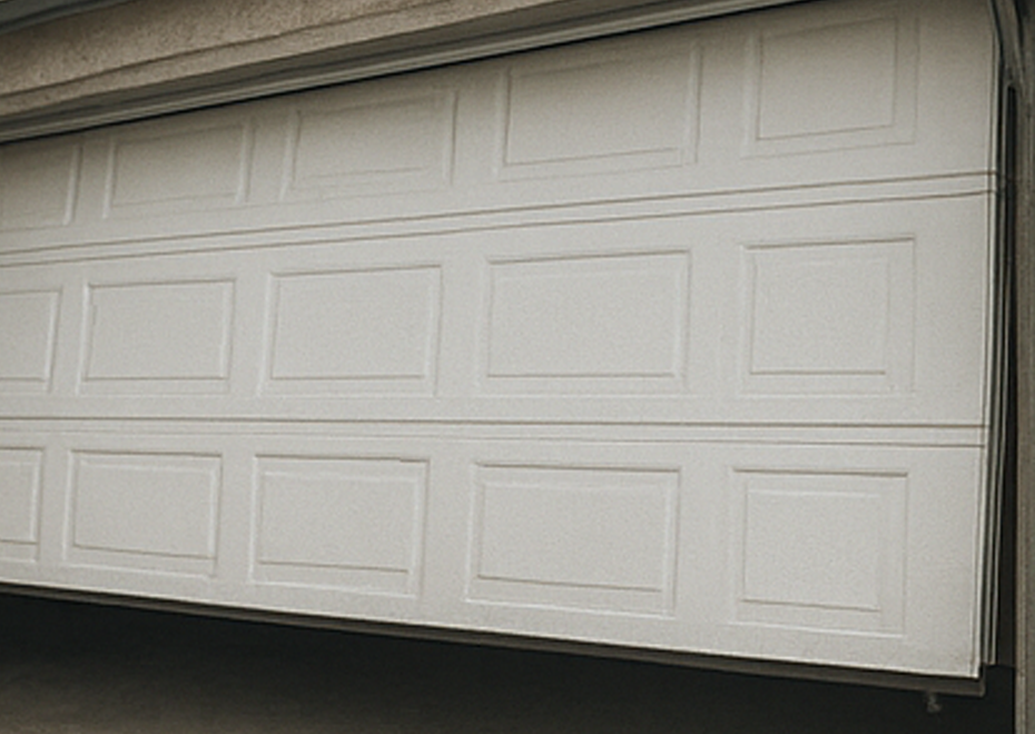 White sectional garage door with brick frame