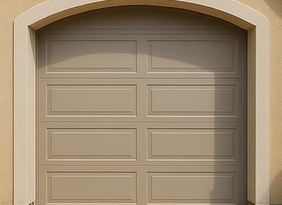 Beige garage door in stucco arch